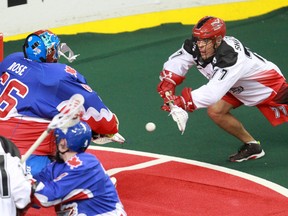 The Calgary Roughnecks' Jeff Shattler scores on Toronto Rock goalie Nick Rose during NLL action at the Scotiabank Saddledome in Calgary on Saturday. (GAVIN YOUNG/POSTMEDIA NETWORK)