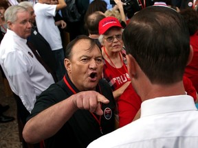 Trump supporter Thomas Nay responds to a Cruz supporter after the man taunted Trump backers after the close of the Republican State Convention at the Mesa Convention Center, Saturday, April 30, 2016, Mesa, Ariz.  (Kelly Presnell/Arizona Daily Star via AP)