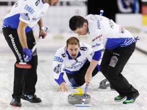Reid Carruthers (centre) throws during the Grand Slam of Curling 2016 Humpty’s Champions Cup play versus the John Shuster rink at Sherwood Park Arena Sports Centre in Sherwood Park, Alta., on Thursday April 28, 2016. Competition runs through May 1.
