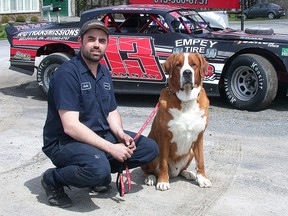 Team Empey Tire pro stock driver Justin Ramsay of Rossmore, shown with mascot, Charlie the Therapy Dog, won his opening night feature Saturday at Brighton Speedway as the 2016 season opened. (Paul Svoboda/The Intelligencer)