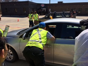 CAA Manitoba and occupational therapists speak with drivers at a CarFit event in May 2016. The event aims to help maturing drivers stay safe behind the wheel­. (Jim Bender, Winnipeg Sun, Postmedia Network)