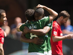 Portland Timbers' Fanendo Adi celebrates with teammate Diego Valeri after scoring a first-half goal against Toronto FC on Sunday. (USA TODAY SPORTS)