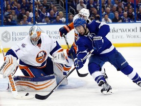 Tampa Bay Lightning center Tyler Johnson attempts to shoot as New York Islanders goalie Thomas Greiss makes a save during the third period of game two of the second round of the 2016 Stanley Cup Playoffs at Amalie Arena. (Kim Klement/USA TODAY Sports)