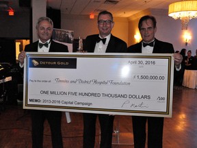 Paul Martin, CEO and president of Detour Gold, presented the Timmins and District Hospital Foundation with a cheque for $1.5 Million at the foundation's Spring Gala on Saturday. Gabriel Provost, left, and Dave McGirr, both members of the Capital Campaign Committee, accepted the cheque on the foundation's behalf.