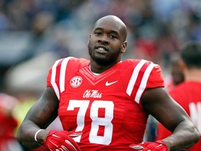 Laremy Tunsil was selected 13th overall Thursday night in the NFL draft by the Miami Dolphins. (AP Photo/Rogelio V. Solis, File)