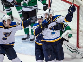 St. Louis Blues center David Backes and left wing Jaden Schwartz and St. Louis Blues right wing Vladimir Tarasenko celebrate Backes scoring the game winning goal against Dallas Stars goalie Antti Niemi during the overtime period in game two of the first round of the 2016 Stanley Cup Playoffs at the American Airlines Center. (Jerome Miron-USA TODAY Sports)