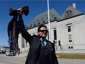 Gabriel Daniels, son of the late Harry Daniels, reacts as he leaves the Supreme Court of Canada in Ottawa on Thursday, April 14, 2016, following a unanimous ruling that Metis and non-status Indians are Indians under the Constitution. SEAN KILPATRICK / THE CANADIAN PRESS