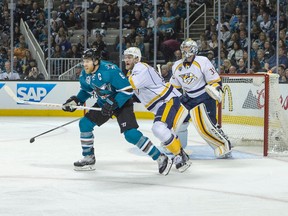 Sharks centre Joe Pavelski (left) fights for position in front of Predators goalie Pekka Rinne (35) in the third period in Game 2 of the second round NHL playoff series in San Jose, Calif., on Sunday, May 1, 2016. (Neville E. Guard/USA TODAY Sports)