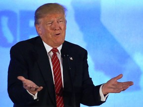 In this April 29, 2016 file photo, Republican presidential candidate Donald Trump speaks at the California Republican Party 2016 convention in Burlingame, Calif. Tens of thousands of immigrants are applying for U.S. citizenship in a year when immigration has taken centre stage in this year's presidential campaign, especially in the race for the GOP nomination. (AP Photo/Jeff Chiu, File)