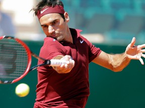 Roger Federer plays a return to Jo-Wilfried Tsonga during their quarterfinal match of the Monte Carlo Tennis Masters in Monaco on April 15. Federer was forced to withdraw from the Madrid Masters because of a back injury on Monday, May 2, 2016. (Lionel Cironneau/AP Photo)