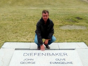 George Dryden is seen at the gravesite of former Canadian prime minister John Diefenbaker on Saturday, April 23, 2016, in Saskatoon. Dryden, 47, who believed he was Diefenbaker's son, killed himself Sunday, May 1, 2016, after a battle with pancreatic disease. (THE CANADIAN PRESS/HO-Lawrence Goertzen)