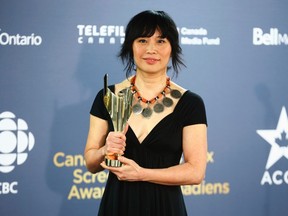 Sook-Yin Lee holds her award for Best Actress in a Drama or Miniseries for role as Canadian politician Olivia Chow in "Jack" at the 2014 Canadian Screen awards in Toronto, March 9, 2014.    REUTERS/Mark Blinch