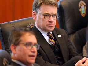 City councillors Marty Morantz (l) and Brian Mayes listen to a presentation during the council debate on water rates in Winnipeg, Man. Wednesday April 27, 2016