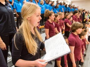 Emily Poulsen, from Earl of March Secondary School, sings with a group of around 400 students from 100 Ottawa schools at Woodroffe High School in celebration of Music Monday, Monday May 02, 2016. DARREN BROWN/POSTMEDIA