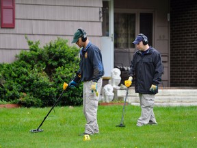 In this Thursday, May 10, 2012, file photo, law enforcement agents search the yard at the home of reputed Connecticut mobster Robert Gentile in Manchester, Conn. Gentile, suspected of having knowledge about long-sought stolen artwork, is due to appear in court in an attempt to get a weapons case dismissed on Wednesday, Jan. 6, 2016. (AP Photo/Jessica Hill, File)