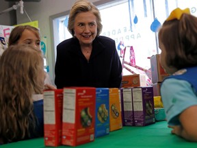 U.S. Democratic presidential candidate Hillary Clinton speaks to Girl Scouts' about buying some cookies during a campaign event in Ashland, Kentucky May 2, 2016. (REUTERS/Jim Young)