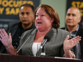 Rita Smith, executive director of the Toronto Taxi Alliance, speaks with media about Uber at Toronto City Hall on Monday, May 2, 2016. (Dave Thomas/Toronto Sun)