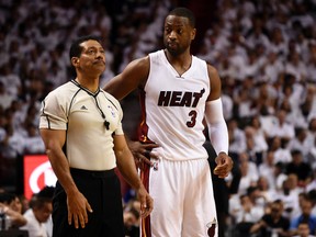 Miami Heat guard Dwyane Wade looks over at NBA referee Bill Kennedy during the first half in Game 7 of the first round of the NBA Playoffs against the Charlotte Hornets at American Airlines Arena in Miami on May 1, 2016. (Steve Mitchell/USA TODAY Sports)