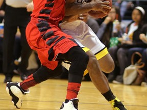 London Lightning?s Akeem Scott draws a foul from Orangeville A?s Lewis Jackson during the first half of Game 1 of their National Basketball League of Canada Central Division first-round playof series at Budweiser Gardens on Monday night. The Lightning won 118-110. (MIKE HENSEN, The London Free Press)