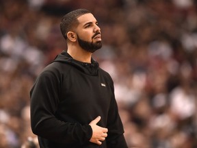 Rapper Drake watches the action between the Indiana Pacers and the Toronto Raptors during first half NBA playoff basketball action in Toronto on Tuesday, April 26, 2016. THE CANADIAN PRESS/Frank Gunn