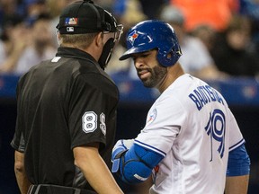 Jose Bautista of the Toronto Blue Jays argues with plate umpire Corey Blaser during the sixth inning of Toronto's game against the Texas Rangers on May 2, 2016. (CRAIG ROBERTSON/Toronto Sun)