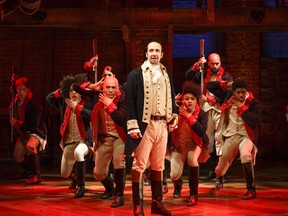 This image released by The Public Theater shows Lin-Manuel Miranda, foreground, with the cast during a performance of "Hamilton," in New York.  (Joan Marcus/The Public Theater via AP)