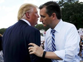 U.S. Sen. Ted Cruz, right, greets businessman Donald Trump onstage as they address a Tea Party rally in Washington in this Sept. 9, 2015 file photo. (REUTERS/Jonathan Ernst/Files)