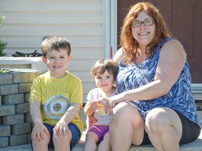 Bonnie Minion and her kids, Alexzander, 5, and Danika, 20 mos., are concerned with the traffic coming through Thistle Crescent as a result of the detour on Tumbleweed Ave. With camping trailers and vehicles lining the streets, visibility is already a challenge in the community, she said. | Caitlin Clow photos/Pincher Creek Echo