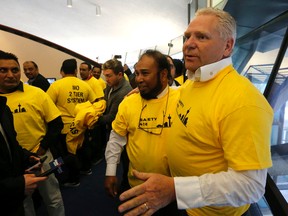 Former councillor Doug Ford arrives to support taxi drivers at the Toronto city council meeting dealing with new rules for Uber and the taxi industry on Tuesday, May 3, 2016. (Michael Peake/Toronto Sun)