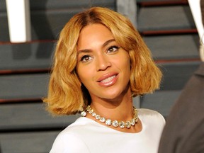 In this Feb. 22, 2015 file photo, Beyonce arrives at the 2015 Vanity Fair Oscar Party in Beverly Hills, Calif. WTRMLN WTR, a startup beverage company that makes cold-pressed watermelon juice, announced on Tuesday, May 3, 2016, that Beyonce has joined as an investor. (Photo by Evan Agostini/Invision/AP, File)