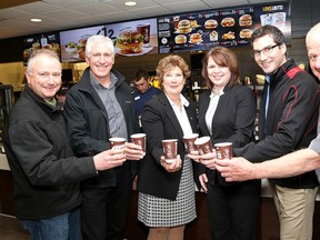 Getting ready for McHappy Day are, from left, Harold Parsons, executive director of the Boys and Girls Club of Kingston and area, club president Peter Kingston, Karen Sutherland of McDonald's restaurants, Liza Nelson, publisher and advertising director of the Kingston Whig-Standard, Steve Serviss, editor-in-chief, and Ron Sutherland of  McDonald's.McHappy Day is Wednesday . (Ian MacAlpine/The Whig-Standard)