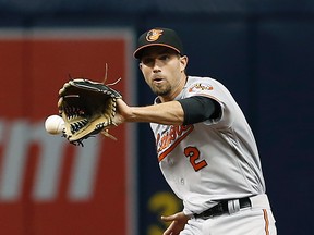 Baltimore Orioles shortstop J.J. Hardy (2) fields the ball during the ninth inning of a game against the Tampa Bay Rays at Tropicana Field. (Reinhold Matay/USA TODAY Sports)