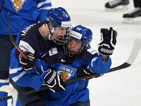 Finland's Patrik Laine (29) celebrates his first period goal against Canada with teammate Jesse Puljujarvi (9) during first period quarter-final hockey action at the IIHF World Junior Championship, in Helsinki, Finland, on Saturday, Jan. 2, 2016.