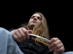 Shawn Soucy, 16, poses at home with his pocket knife in Saint-Remi, Que., May 1, 2016. (Christinne Muschi for Postmedia News)