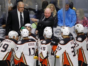 Anaheim Ducks head coach Bruce Boudreau talks to his players during a timeout in the third period of an NHL hockey game against the Nashville Predators in Nashville, Tenn., on Nov. 17, 2015. (AP Photo/Mark Humphrey)