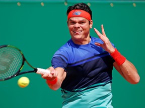 Milos Raonic moved on to the third round of the Madrid Open by downing Alexandr Dolgopolov in three sets. (REUTERS/Eric Gaillard)