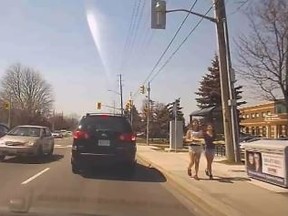 A car is seen driving between two cars headed in the opposite direction in Markham on April 18. (YRP)