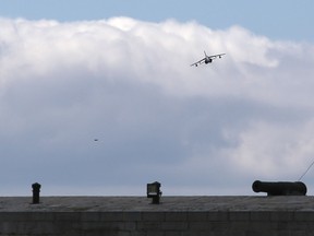 An Alpha Jet flies over Fort Henry during a training exercise and demonstration for Royal Military College cadets on Tuesday. (Elliot Ferguson/The Whig-Standard)