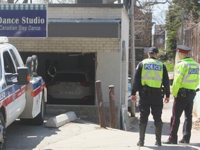 Toronto Police at the scene at Bold Steps Dance Studio in the Beaches Tuesday, May 3, 2016 after an SUV crashed through the window, killing a 68-year-old woman and injuring two others. (CHRIS DOUCETTE/TORONTO SUN)
