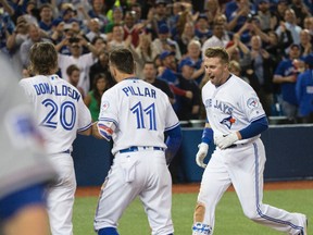 Toronto Blue Jays first baseman Justin Smoak hits a walk-off home run  against the Texas Rangers in the 10th inning in at the Air Canada Centre in Toronto on May 3, 2016. (Craig Robertson/Toronto Sun/Postmedia Network)