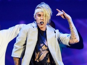 In this March 20, 2016 file photo, Justin Bieber performs during his "Purpose World Tour" in Los Angeles.  (Photo by Chris Pizzello/Invision/AP, File)