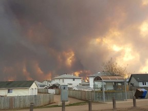 An evacuation order has been given to residents in several neighbourhoods around Fort McMurray, Alta., as flames from a growing wildfire threaten the city. (Mary Sexsmith)