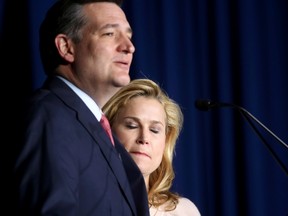 Heidi Cruz, wife of Republican U.S. presidential candidate Senator Ted Cruz, bites her lip and closes her eyes as she listens to her husband drop out of the race for the 2016 Republican presidential nomination during his Indiana primary night rally in Indianapolis on May 3, 2016.    (REUTERS/Chris Bergin)