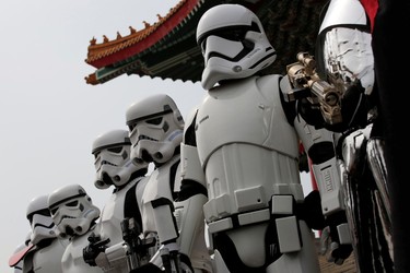 Fans dressed as Storm Troopers from "Star Wars" pose for a photo during Star Wars Day in Taipei, Taiwan, May 4, 2016. REUTERS/Tyrone Siu