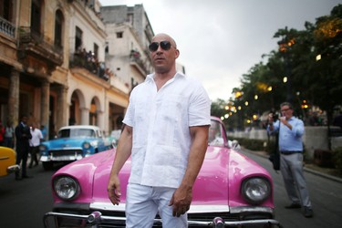 Actor Vin Diesel poses before a fashion show by German designer Karl Lagerfeld as part of his latest inter-seasonal Cruise collection for fashion house Chanel at the Paseo del Prado street in Havana, Cuba, May 3, 2016. REUTERS/Alexandre Meneghini