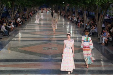 Models present creations by German designer Karl Lagerfeld as part of his latest inter-seasonal Cruise collection for fashion house Chanel at the Paseo del Prado street in Havana, Cuba, May 3, 2016. REUTERS/Alexandre Meneghini