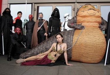Fans dressed as movie Star Wars characters pose as they cerebrate the Star Wars Day in Taipei, Taiwan, Wednesday, May 4, 2016. May 4 is known as Star Wars Day among fans worldwide since the date sounds phonetically similar to the franchise's slogan, "May the Force Be With You." (AP Photo/Chiang Ying-ying)