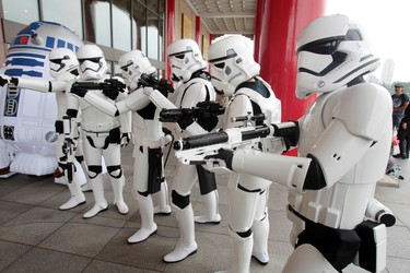 Fans dressed as movie Star Wars characters pose as they cerebrate the Star Wars Day in Taipei, Taiwan, Wednesday, May 4, 2016. May 4 is known as Star Wars Day to fans worldwide since the date is similar to the franchise's slogan, "May the Force Be With You." (AP Photo/Chiang Ying-ying)