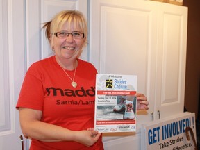 MADD Sarnia-Lambton President Natalie Andrews holds up the promotional poster for the organization's sixth annual Strides for Change 5k walk, which takes place in Canatara Park on Sunday, May 15.
CARL HNATYSHYN/SARNIA THIS WEEK