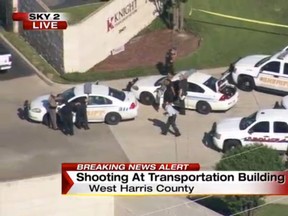 Officers respond to reports of a deadly shooting at the Knight Transportation office in Katy, Texas, Wednesday, May 4, 2016. Authorities said a recently fired employee opened fire at the transportation company. (KPRC Houston via AP)